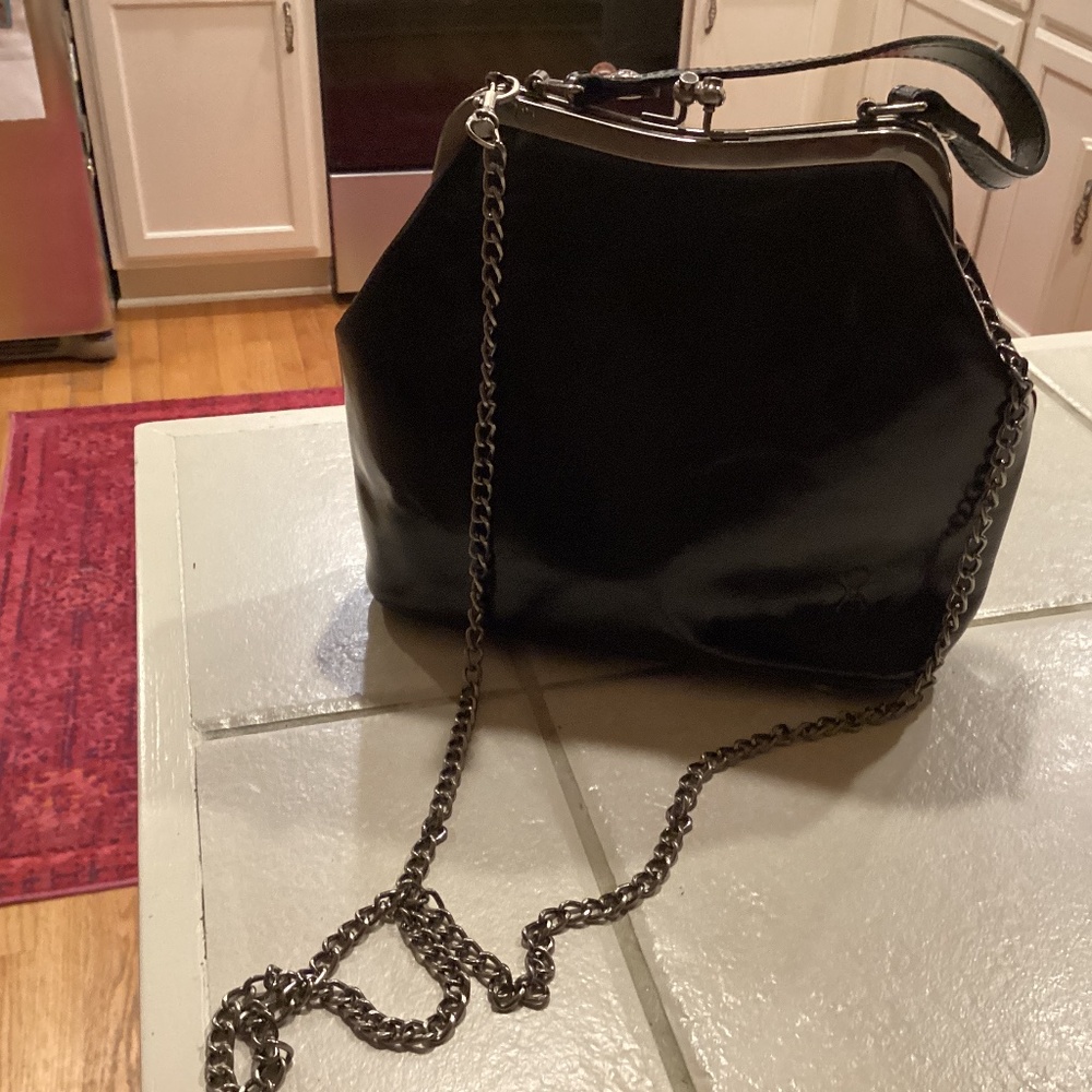 Clip close leather antique style handbag
